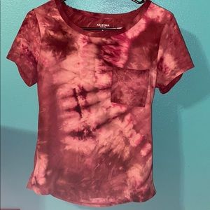 Acid wash T-shirt with small pocket.